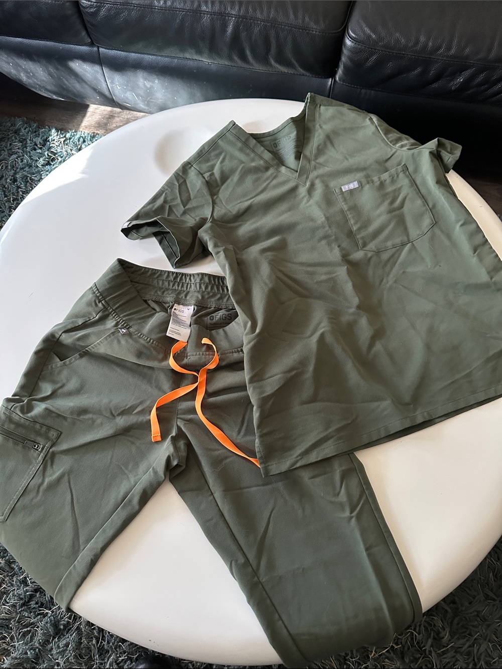 Figs Women’s Olive Green Scrub Pants and scrub top.